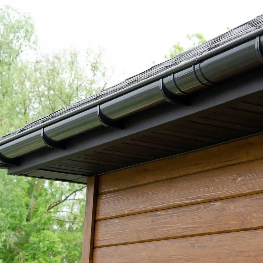 Black guttering and soffit detail on an exterior roofline completed by ABL Roofing Solutions