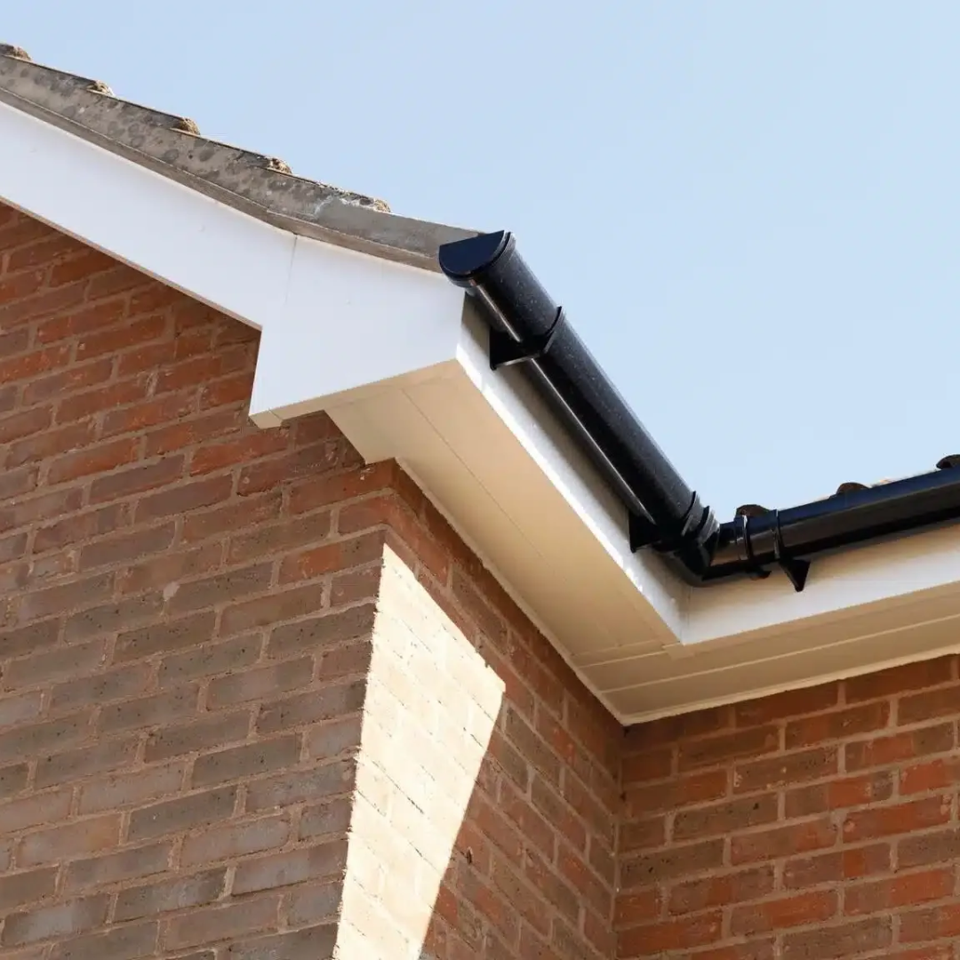 White fascias and black guttering installed on a brick home by ABL Roofing Solutions